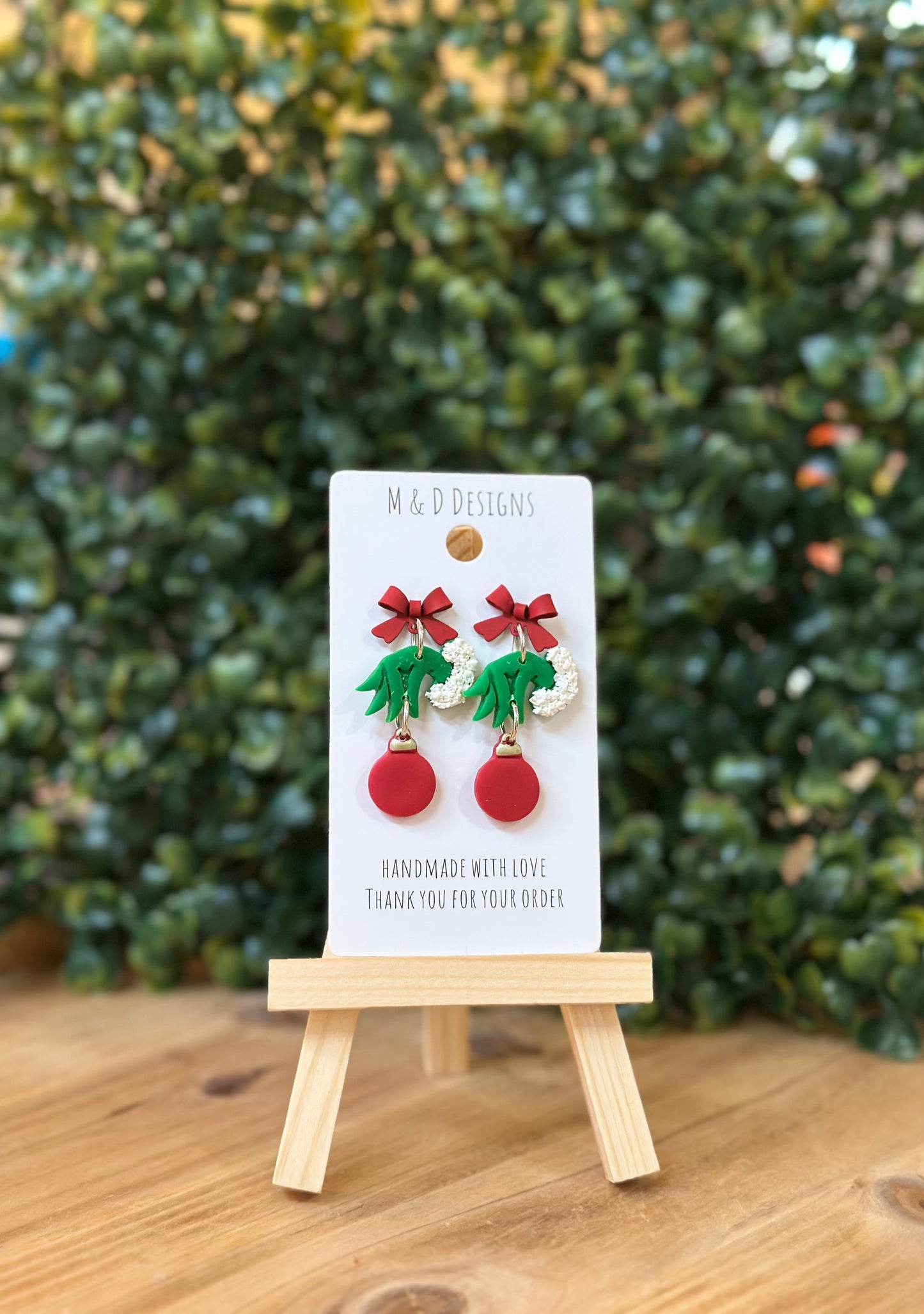 Green Christmas Monster Hand Holding Ornament